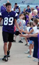 Wide Receiver Ross Lane slaps five with young Wildcat fans.