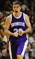 Northwestern's Craig Moore reacts after hitting a 3-point shot against Minnesota with less than two minutes remaining. (AP Photo/Tom Olmscheid)