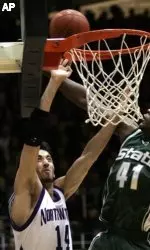Northwestern's Mohamed Hachad shoots over Michigan State's Marquise Gray during second half. (AP Photo/M. Spencer Green)