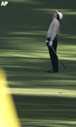 Dillon Dougherty reacts after hitting his shot into the sand on the second hole during first round play of the Masters golf tournament at the Augusta National Golf Club in Augusta, Ga.