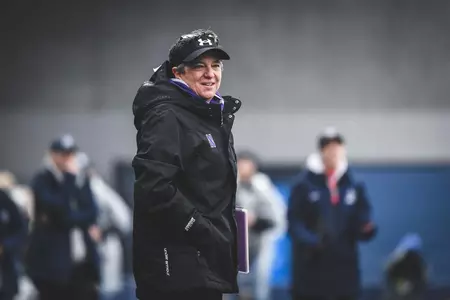 Tracey Fuchs watches from the sidelines during the 2021 National Championship Game