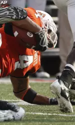 Oklahoma State linebacker Patrick Lavine is brought down after an interception off Georgia quarterback Joe Cox.