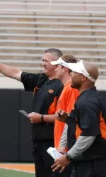 Coaches discussing spring practice.