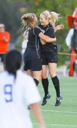 Catherine Parish (right) celebrates her first-half goal Friday night against Memphis.