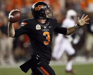 Oklahoma State quarterback Brandon Weeden (3) throws against Stanford during the first half of the Fiesta Bowl NCAA college football game Monday, Jan. 2, 2012, in Glendale, Ariz. (AP Photo/Matt York)