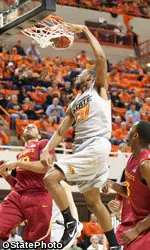 Michael Cobbins dunks over Iowa State defense.