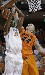 Texas' Prince Ibeh, left, is blocked by Philip Jurick. (AP Photo/Eric Gay)