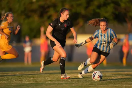 Adeline Nemeth dribbles past the goalkeeper for a goal