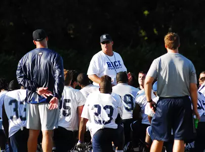 David Bailiff talks to his team after their first practice