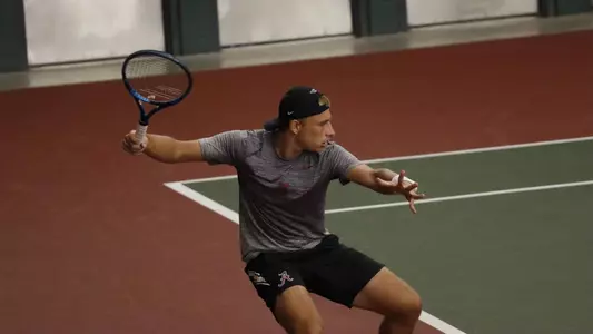 German Samofalov hitting the ball 