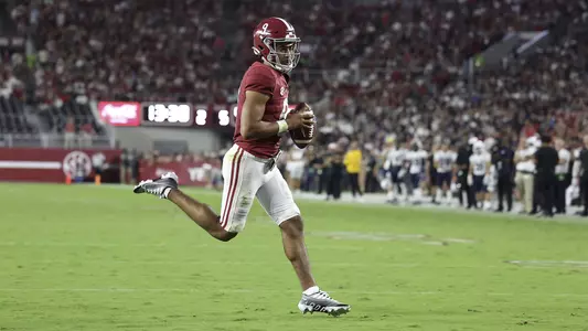 Bryce Young running the ball in for a touchdown