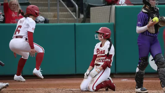 Alabama softball player Kali Heivilin slides home.
