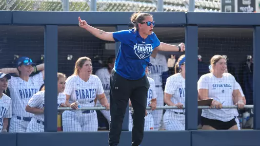 Angie Churchill coaching third base
