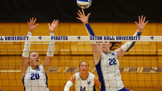 Daria Safian and Alex Rasmussen attempts a block against Iona on Sept. 5