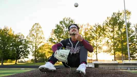 Pitcher for SIU Baseball Al Holguin sits on the pitchers mound for a portrait Wednesday October 2, 2024 at Itchy Jones Stadium in Carbondale Ill. (Abby Harris)