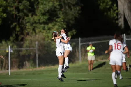 Sophie Santos and Isabella Santavicca celebrate vs Green Bay