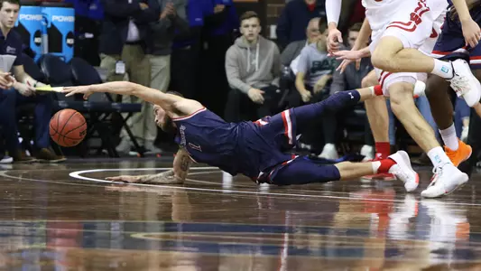Logan Johnson hits the deck for a loose ball vs. Wisconsin at the Sanford Pentagon on Nov. 5, 2019.