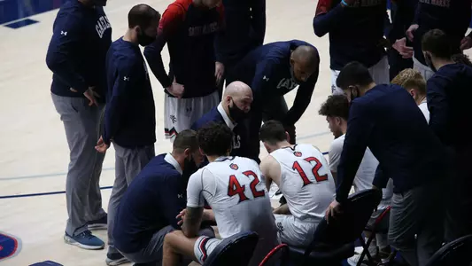 Team huddle with Bennett