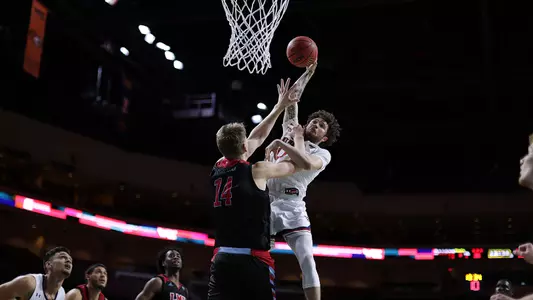 Logan Johnson going for the poster dunk vs LMU