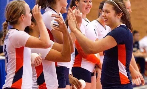 Nicolette Serratore high fives team mates.