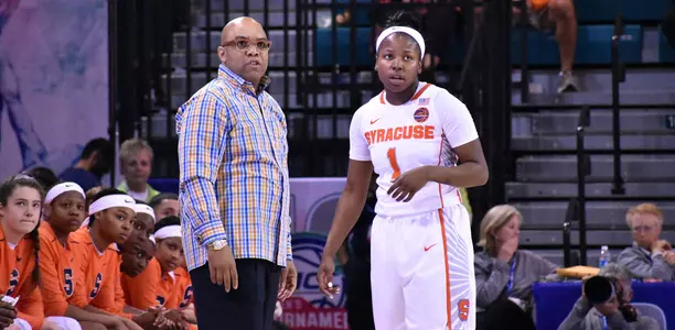 Head coach Quentin Hillsman chats with Alexis Peterson.