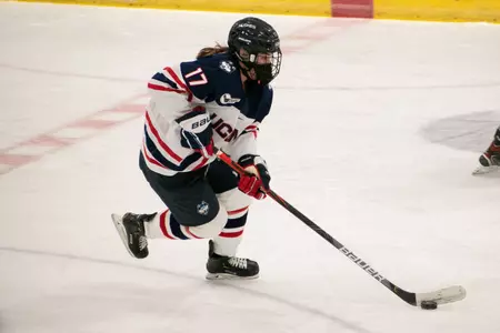 Savannah Bouzide controls the puck against Maine on February 5, 2021.