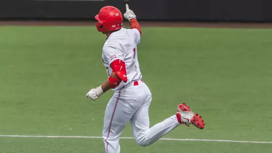 Xavier Perez points while rounding the bases. 