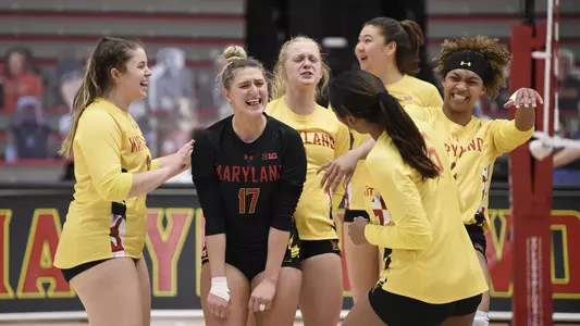 volleball team celebrates win over northwestern