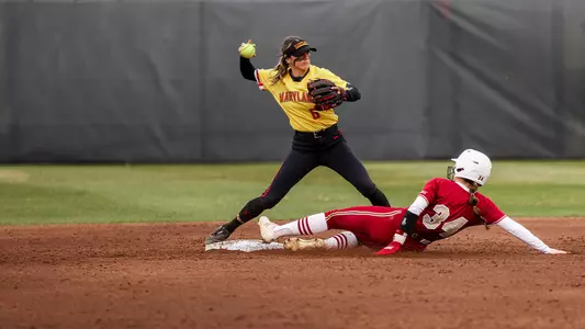 Madison Runyan turning a double play at second base.