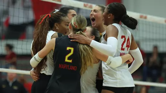 Maryland celebrates a kill against Iowa