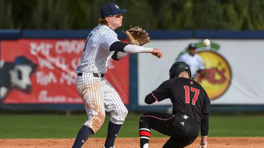 Tanner May throws the ball over to first