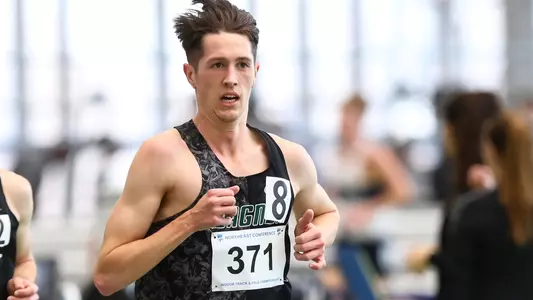 Jonathan Besselink running in a cross country meet at Wagner