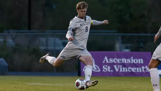 LJ Estes kicking soccer ball