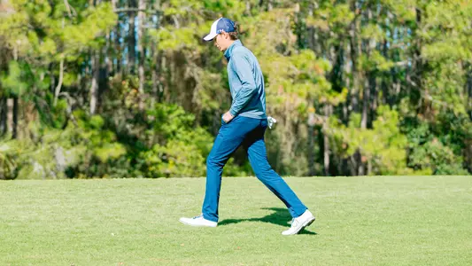 Nick Gabrelcik walking the fairway on a golf course