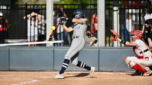 Madisyn Federico hitting ball against Liberty