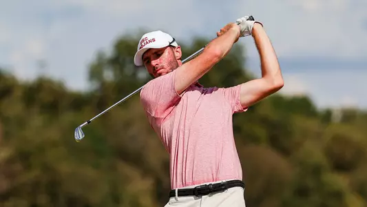 Luke Stock swings an iron at the Trinity Forest Invitational