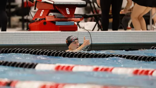 Michal Chmielewski holding a thumbs up after a race in the Big Ten Championships