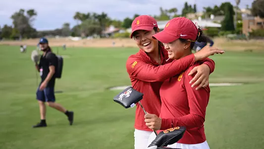Kylie Chong hugs Elise Lee after USC wins the 2026 NCAA semifinals matchup against Arkansas