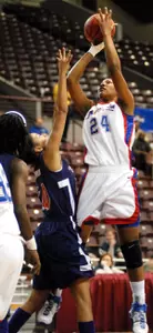 24 - UT Arlington junior center Tiffeny Riles (24) shoots over Northwestern State's Ashli Barnum during the first half of the Mavs' 62-53 win over the Demons in the opening round of the O'Reilly Auto Parts Southland Conference Basketball Tournament Wednesday night. Riles finished with a team-high 16 points to lead the Mavs into Friday's semifinals. (Robert Crosby UTA Photo Services)