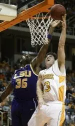 Tennessee's Dane Bradshaw (23) puts up a shot against Louisiana State's Darnell Lazare (35) during the first half of a college basketball game Tuesday, Feb. 6, 2007, in Knoxville, Tenn. (AP Photo/Wade Payne)