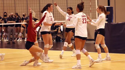 The Badgers celebrate winning set two over Weber State.