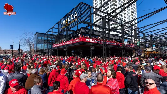 Milwaukee Badger fans celebrate at The Mecca outside Fiserv Forum
