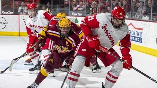 Carson Bantle battles for the puck in a game against Minnesota.