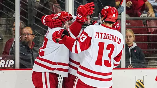 Wisconsin men's hockey team celebrates scoring a goal
