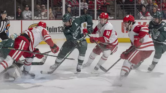 Ryland Mosley and Quinn Finley battle for the puck in front of the Michigan State net