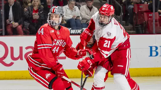 Carson Bantle battles for the puck against an Ohio State player.