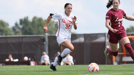 National Women's Soccer League players pause mid-match, stand in