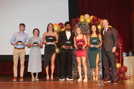2023 Golden Nole Award Show:

ACC TOP 6 FOR SERVICE - (L-R): Lucas Bouquot, Track & Field; Dani Thompson, Cross Country; Arianni Ottavianelli, Swimming & Diving; C.J. Campbell, Jr., Football; Madison Slater, Cross Country, Victoria Cervantes, Swimming & diving, & Athletic Director Michael Alford.



