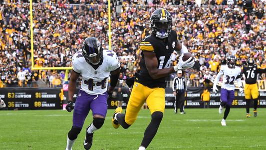 George Pickens of the Pittsburgh Steelers breaks a tackle by Nolan News  Photo - Getty Images