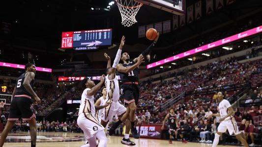 Mason Faulkner of the Louisville Cardinals brings the ball up court News  Photo - Getty Images